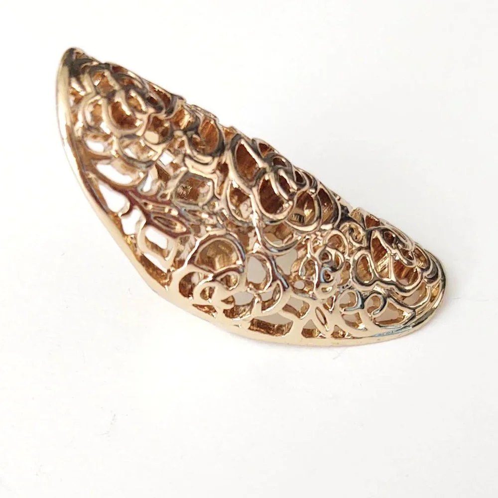 Long, open scroll design gold ring